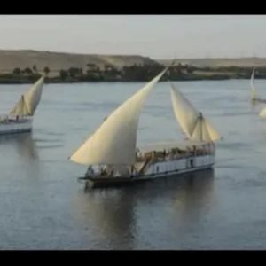 Egypt, Nile River, Dahabiya ship, luxury, vacation, history, culture, natural beauty, Nebyt Dahabiya, deluxe, cabins, sundeck, hot tubs, dining, cuisine, onboard facilities, excursions, activities, ancient temples, Nubian villages, felucca rides, guides, unforgettable experience.