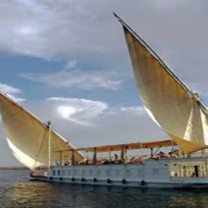 Egypt, Nile River, Dahabiya ship, luxury, vacation, history, culture, natural beauty, Nebyt Dahabiya, deluxe, cabins, sundeck, hot tubs, dining, cuisine, onboard facilities, excursions, activities, ancient temples, Nubian villages, felucca rides, guides, unforgettable experience.