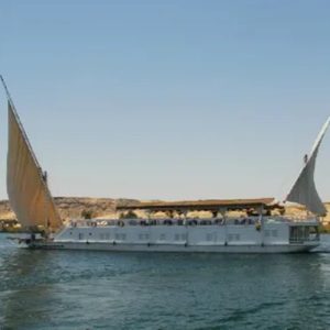Egypt, Nile River, Dahabiya ship, luxury, vacation, history, culture, natural beauty, Nebyt Dahabiya, deluxe, cabins, sundeck, hot tubs, dining, cuisine, onboard facilities, excursions, activities, ancient temples, Nubian villages, felucca rides, guides, unforgettable experience.