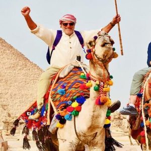 Camel and rider in front of the pyramid of Khafre (Chephren), at the Pyramids of Giza, Cairo, Egypt