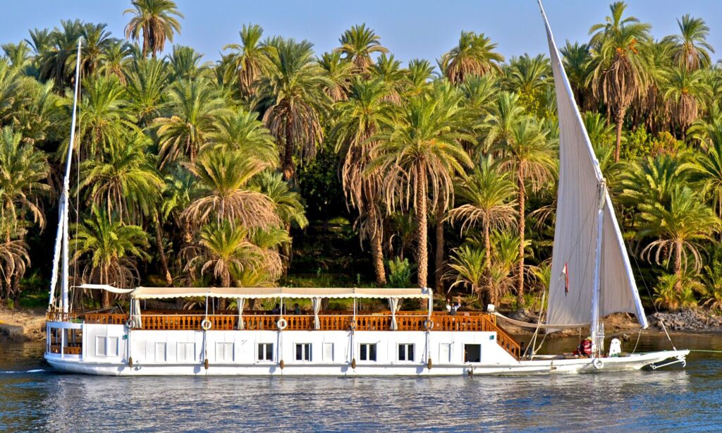 Nile Cruise, Egypt, Dahabiya, Felucca, Luxor, Aswan, Ancient Egypt, History, Solar Motors, Cabin, Dining, Swimming Pool, Gym, Luxor Temple, Karnak Temple, East Bank, West Bank, Kom Ombo, Edfu, Esna, Philae Temple, High Dam, Lake Nasser, Abu Simbel Temple, Marinas, Airport, Train Station, Private Tours, Group Tours, Temperature, Seasons, Entertainment, Discotheque, Belly Dance, Galabia Party, Nubian Folkloric Show, Full Board Basis, All Inclusive Basis, Check In, Check Out, Attire, Cultural Norms, Itinerary, Hot Air Balloon, Old Markets, Nubian Village, Carriage Tour, Abu Simbel, Sound and Light Show Planning.