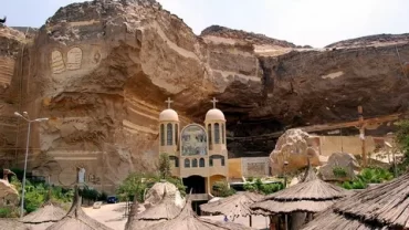 carved churches, Mokattam Hills churches, Ancient Egyptian Christianity, Rock-hewn sanctuaries, Mountain monastic sites, St. Simeon the Tanner Church, Coptic carved churches, Hidden mountain churches, Early Christian pilgrimage sites, Desert monasteries Egypt, Biblical frescoes in Egypt