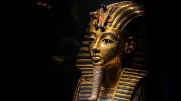 The Golden Mask of Tutankhamun, Ancient Egyptian Artifact, Howard Carter Discovery, Pharaoh's Burial Mask, 18th Dynasty Egypt, Tutankhamen's Tomb, Valley of the Kings, Egyptian Antiquities, Semi-Precious Inlays, Historical Relic, Egyptology Milestone