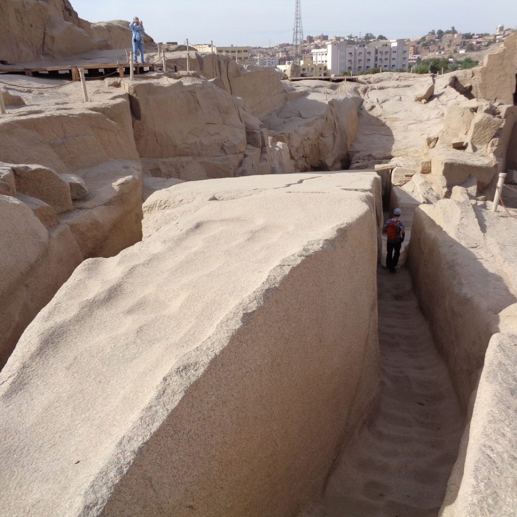 The Unfinished Obelisk, Aswan,
Aswan Granite Quarry,
Hatshepsut’s Monument,
Ancient Egyptian Engineering,
Granite Carving Techniques,
Obelisk Crack Mystery,
New Kingdom Architecture,
Dolerite Ball Tools,
Archaeological Discoveries,
Egyptian Sun God Ra,
Monumental Abandonment