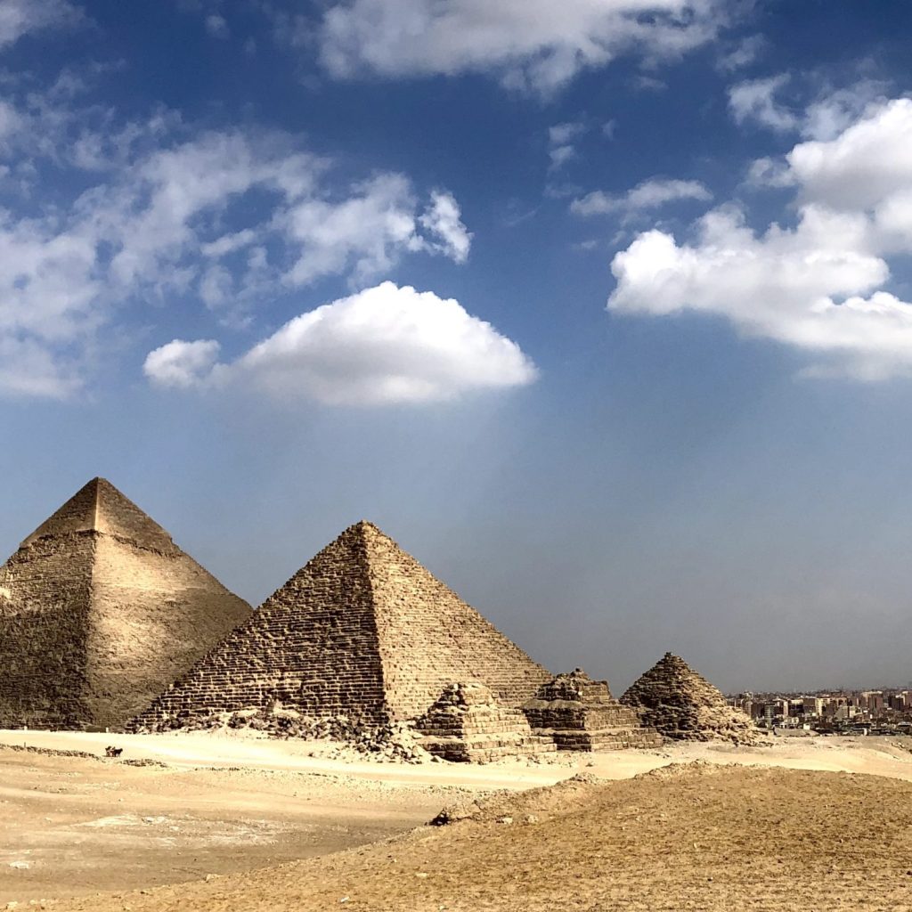 Egyptian pyramids at Giza, Giza Plateau, Ancient Egyptian architecture, Khufu Pyramid, Fourth Dynasty tombs, Pyramid alignment, Limestone monoliths, Pharaohs' legacy, Giza necropolis, Pyramid mysteries, Sphinx guardian